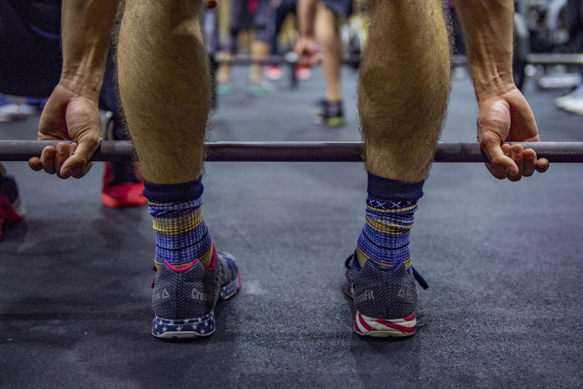 A participant holds onto exercise bar during the LifeFit Tour exercise demonstration March 21, 2017, at Yokota Air Base, Japan. The event included four professional CrossFit coaches and competitors and included an exercise, coaching and a Q-and-A portion. (U.S. Air Force photo by Airman 1st Class Donald Hudson)