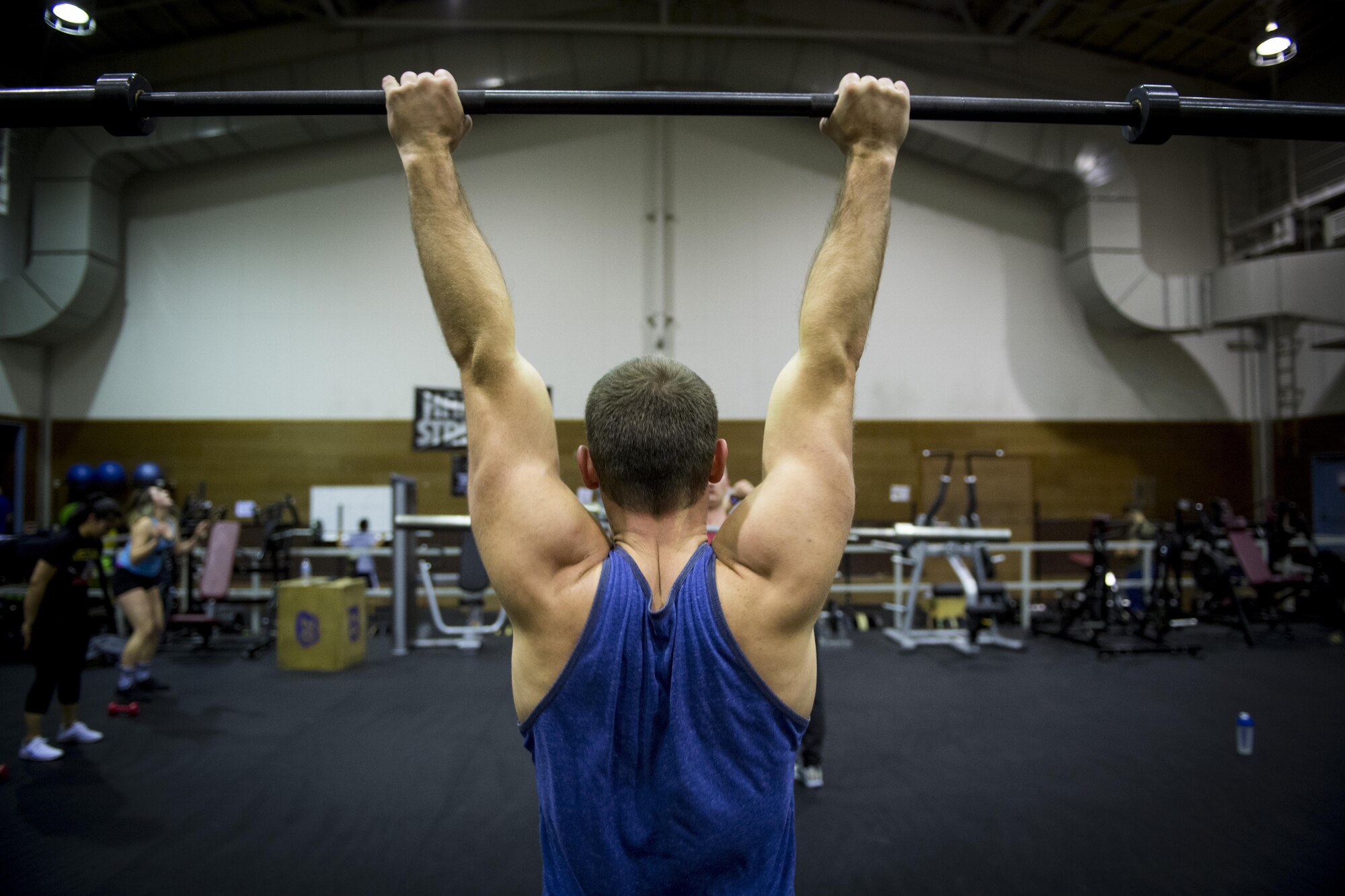 A participant holds up exercise bar during the LifeFit Tour exercise demonstration March 21, 2017, at Yokota Air Base, Japan. The event included four professional CrossFit coaches and competitors and included an exercise, coaching and a Q-and-A portion. (U.S. Air Force photo by Airman 1st Class Donald Hudson)