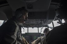 U.S. Air Force Brig. Gen. Barry Cornish, 18th Wing commander, orientates himself on the flight deck of a 17th Special Operations Squadron MC-130J Commando II before a training sortie March 21, 2017, at Kadena Air Base, Japan. Cornish flew with the 17th SOS to experience first-hand the tactical capabilities of the MC-130J and its aircrew. (U.S. Air Force photo by Airman 1st Class Corey Pettis)