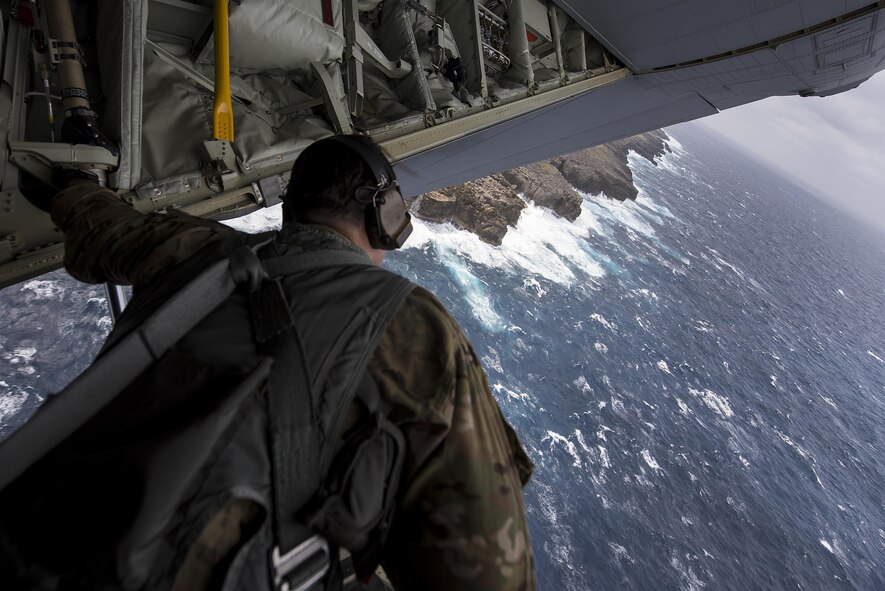 U.S. Air Force Tech. Sgt. Kade Bollinger, 17th Special Operations Squadron MC-130J Commando II instructor loadmaster, observes the water during a training sortie March 21, 2017, off the coast of Okinawa, Japan. Bollinger conducted low altitude training with Brig. Gen. Barry Cornish, 18th Wing commander, so he could experience the combat flight capabilities of the MC-130J and its aircrew. (U.S. Air Force photo by Airman 1st Class Corey Pettis)
