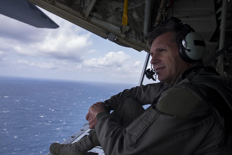 U.S. Air Force Brig. Gen. Barry Cornish, 18th Wing commander, observes the horizon from the cargo bay of a 17th Special Operations Squadron MC-130J Commando II cargo plane during a training sortie March 21, 2017, off the coast of Okinawa, Japan. Cornish conducted low altitude flight training with the 17th SOS to experience first-hand the tactical capabilities of the MC-130J and to better understand the unit’s interoperability with the 18th Wing. (U.S. Air Force photo by Airman 1st Class Corey Pettis)
