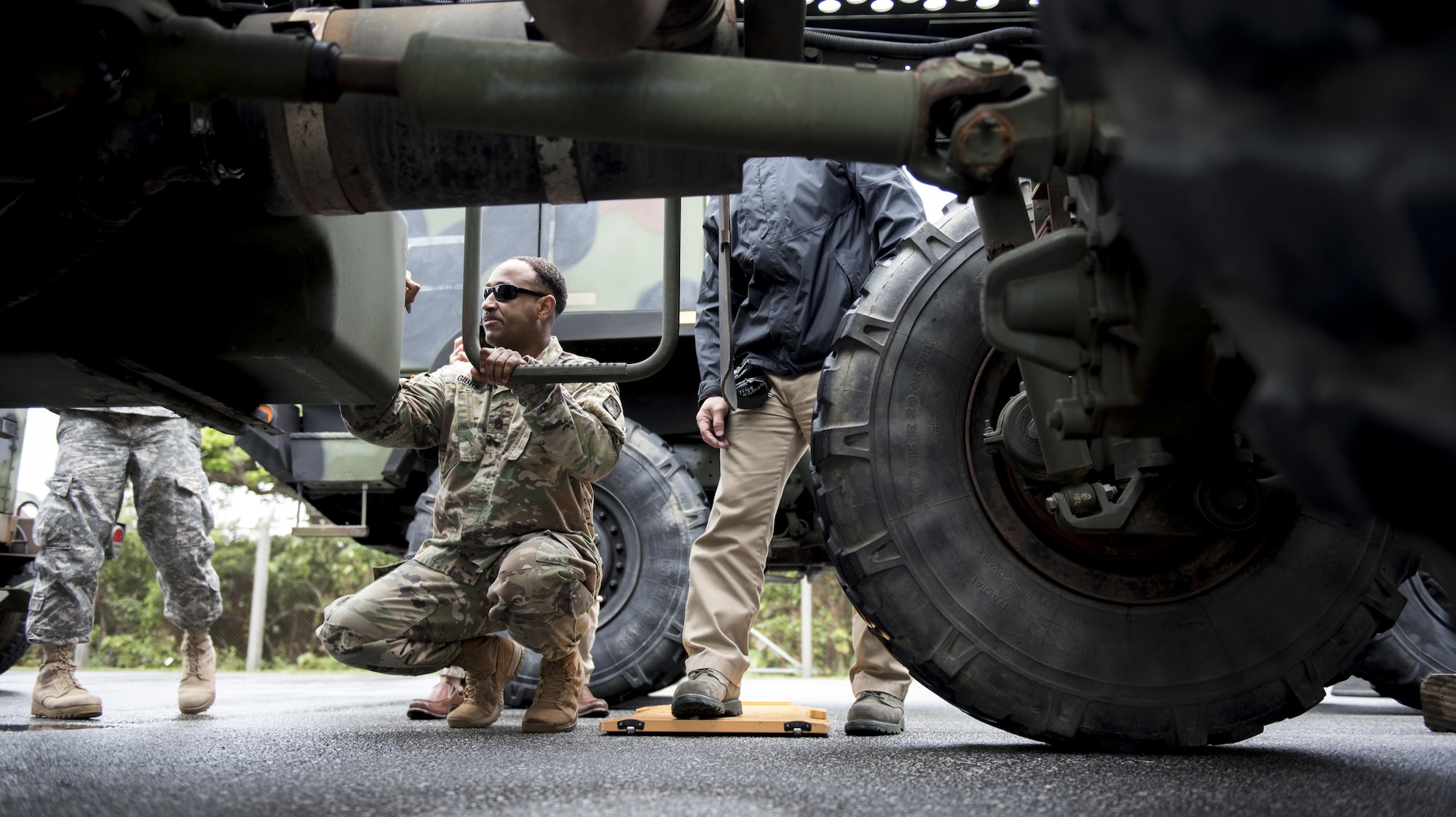 U.S. Army Staff Sgt. Dawayn Gibbs, 1st Battalion, 1st Air Defense Artillery Regiement headquarters noncommissioned officer-in-charge, writes down the weight of a Patriot missile battery during rapid load training March 14, 2017, on Kadena Air Base, Japan. U.S. Soldiers from the 1-1 ADA train alongside units from the Japan Self-Defense force regularly to provide missile defense for Okinawa.  (U.S. Air Force photo by Senior Airman Omari Bernard)