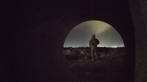 A Soldier with the 136th Infantry Battalion Chosen Company 2nd Platoon Aerial Reaction Force sweeps for mines during a training exercise March 7, 2017 at Bagram Airfield, Afghanistan. The units held several tabletop training sessions which culminated in a practical exercise involving a simulated downed aircraft. (U.S. Air Force photo by Staff Sgt. Katherine Spessa)