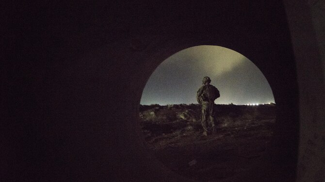 A Soldier with the 136th Infantry Battalion Chosen Company 2nd Platoon Aerial Reaction Force sweeps for mines during a training exercise March 7, 2017 at Bagram Airfield, Afghanistan. The units held several tabletop training sessions which culminated in a practical exercise involving a simulated downed aircraft. (U.S. Air Force photo by Staff Sgt. Katherine Spessa)