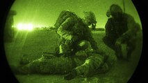 Infantrymen with the 136th Infantry Battalion Chosen Company 2nd Platoon Aerial Reaction Force and an 83rd Expeditionary Rescue Squadron pararescueman treat a patient during a joint training exercise March 7, 2017 at Bagram Airfield, Afghanistan. The units held several tabletop training sessions which culminated in a practical combat search and rescue exercise involving a simulated downed aircraft. (U.S. Air Force photo by Staff Sgt. Katherine Spessa)