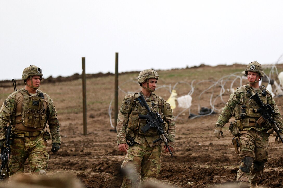 Army Pfc. Matthew Wilson, center, and team members conduct a site survey of a tactical assembly area during a mission supporting the Iraqi army's 9th Division near Al Tarab, Iraq, March 18, 2017. Army photo by Staff Sgt. Jason Hull