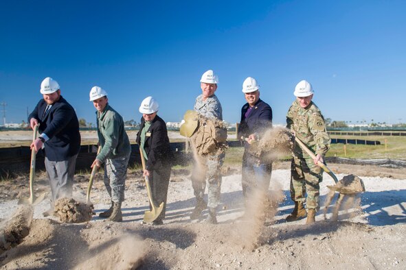 (From left to right) Thomas Self, Senator Marco Rubio’s regional director for the Central Florida region; Col. Burton Catledge, 45th Operations Group commander; Barbara Arthur, Senator Bill Nelson’s regional director; Brig. Gen. Wayne Monteith, 45th Space Wing commander; Rob Medina, Congressman Bill Posey’s director of community and military relations; and Lt. Col. Landon Raby, U.S. Army Corps of Engineers Mobile District deputy commander, dig in during a groundbreaking ceremony for the new Range Communications Facility March 16, 2017, at Cape Canaveral Air Force Station, Fla. The new $18.6 million facility is slated to be a 32,314-square-foot facility, replacing the former XY building and is scheduled for completion in 2018. (U.S. Air Force photo/Matthew Jurgens)   
