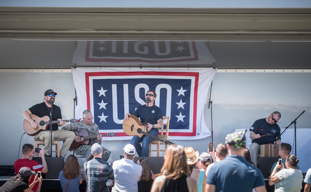 Air Force Gen. Paul J. Selva, vice chairman of the Joint Chiefs of Staff, performs with country music star Craig Morgan and his band during a USO show at Joint Base Pearl Harbor-Hickam, Hawaii, March 25, 2017. Selva, along with USO entertainers, visited service members stationed at various locations around the globe. DoD photo by Army Sgt. James K. McCann