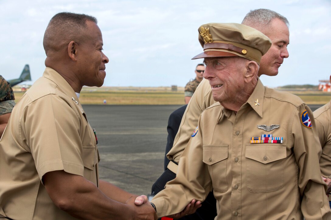 Marine Corps Major General Craig Q. Timberlake, left, commander, 3rd Marine Division, greets Iwo Jima veteran, retired U.S. Army Air Corps Capt. Jerry Allen, after landing on the flightline of Iwo To, Japan, March 25, 2017. They were there for the 72nd anniversary of the Battle of Iwo Jima at the Reunion of Honor memorial. Allen was one of eight Iwo Jima veterans in attendance alongside American and Japanese distinguished guests, both military and civilian. This event presented the opportunity for the U.S. and Japanese people to mutually remember and honor thousands of service members who fought and died on the hallowed grounds of Iwo Jima. Marine Corps photo by Lance Cpl. Brooke Deiters
