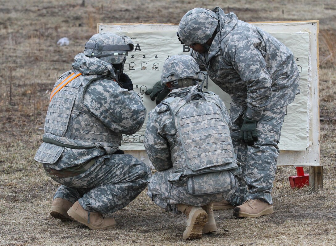 U.S. Army Reserve Soldiers check an M240B machine gun qualification target for ground qualification during Operation Cold Steel at Fort McCoy, Wis., March 25, 2017. Operation Cold Steel is the U.S. Army Reserve's crew-served weapons qualification and validation exercise to ensure that America's Army Reserve units and Soldiers are trained and ready to deploy on short-notice and bring combat-ready and lethal firepower in support of the Army and our joint partners anywhere in the world. (U.S. Army Reserve photo by Staff Sgt. Debralee Best, 84th Training Command)