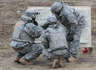 U.S. Army Reserve Soldiers check an M240B machine gun qualification target for ground qualification during Operation Cold Steel at Fort McCoy, Wis., March 25, 2017. Operation Cold Steel is the U.S. Army Reserve's crew-served weapons qualification and validation exercise to ensure that America's Army Reserve units and Soldiers are trained and ready to deploy on short-notice and bring combat-ready and lethal firepower in support of the Army and our joint partners anywhere in the world. (U.S. Army Reserve photo by Staff Sgt. Debralee Best, 84th Training Command)