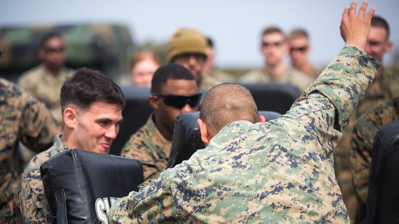 Gunnery Sgt. Ysac Perez, the air base ground defense staff non-commissioned officer in charge for Marine Wing Support Squadron (MWSS) 171, observes how Marines deal with the set objectives during Exercise Tanuki Wrath on Marine Corps Air Station Iwakuni, Japan, March 22, 2017. MWSS-171 conducted the exercise to help train Marines to set up security around a downed aircraft and how to control a riot. 