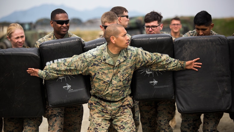 Gunnery Sgt. Ysac Perez, the air base ground defense staff non-commissioned officer in charge for Marine Wing Support Squadron (MWSS) 171, observes how Marines deal with the set objectives during Exercise Tanuki Wrath on Marine Corps Air Station Iwakuni, Japan, March 22, 2017. MWSS-171 conducted the exercise to help train Marines to set up security around a downed aircraft and how to control a riot. 