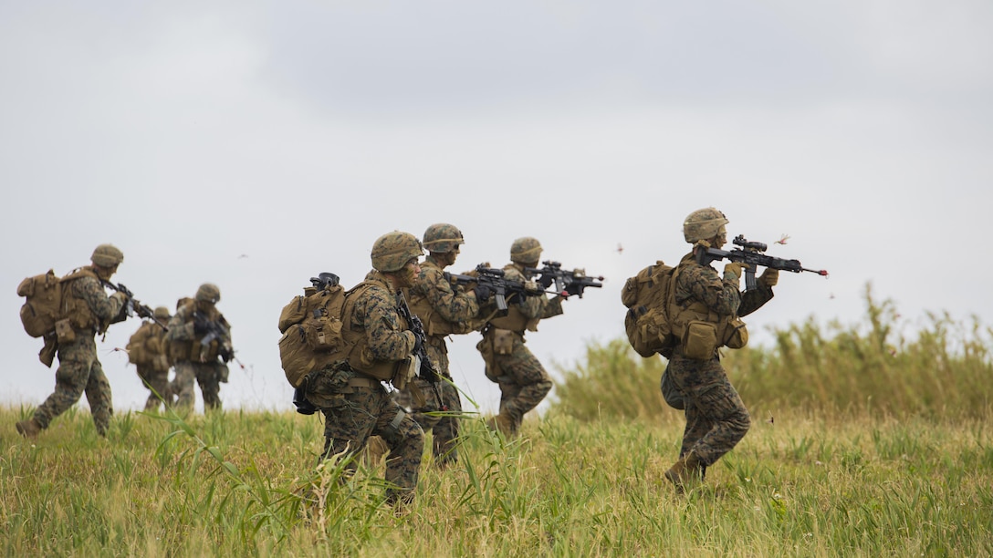 U.S Marines rush an enemy position during a vertical assault on Ie Shima Island, Japan, March 24, 2017. The assault took place as part of a certification exercise conducted by Expeditionary Operations Training Group. CERTEX involves vertical assault raids, humanitarian assistance and disaster relief training, as part of a readiness evaluation for the 31st Marine Expeditionary Unit to join the U.S. Navy’s 7th Fleet. The Marines are with Golf Company, 2nd Battalion, 5th Marine Regiment, assigned to the 31st MEU, III Marine Expeditionary Force.