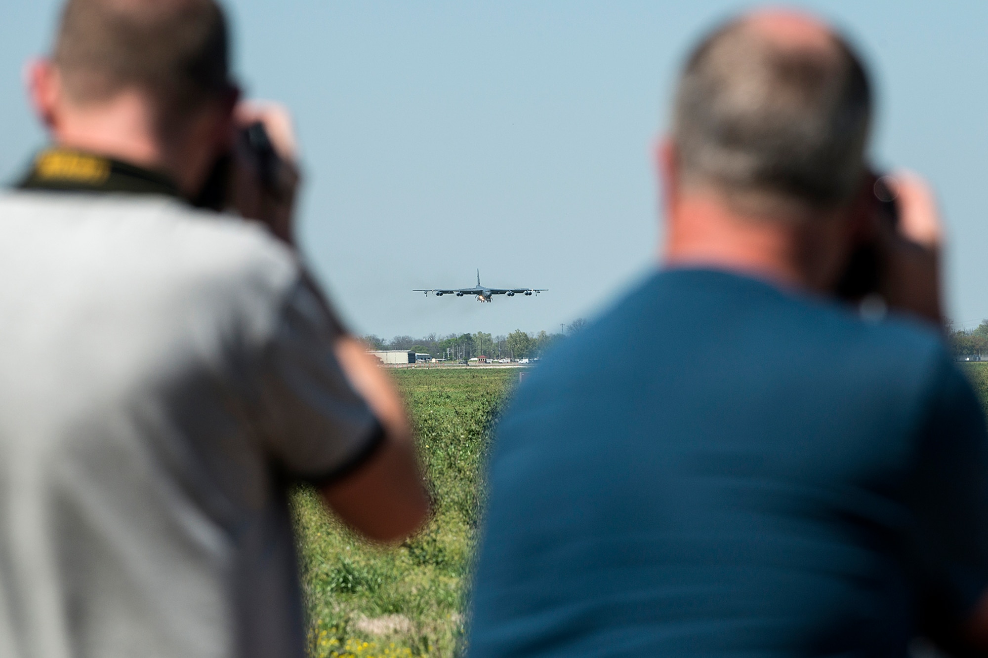 Dick Wels and Hans Drost take photos of a 307th Bomb Wing B-52H Stratofortress as it comes in for a landing on Mar. 23, 2017, Barksdale Air Force Base, La. Wels and Drost represent Recce Reports, a photojournalist team from the Netherlands who specialize in aircraft photography, and submit photos and articles for aviation magazines such as Combat Aircraft, Full Stop, Pacific Wings and Air Forces Monthly. (U.S. Air Force photo by Master Sgt. Greg Steele/Released)
