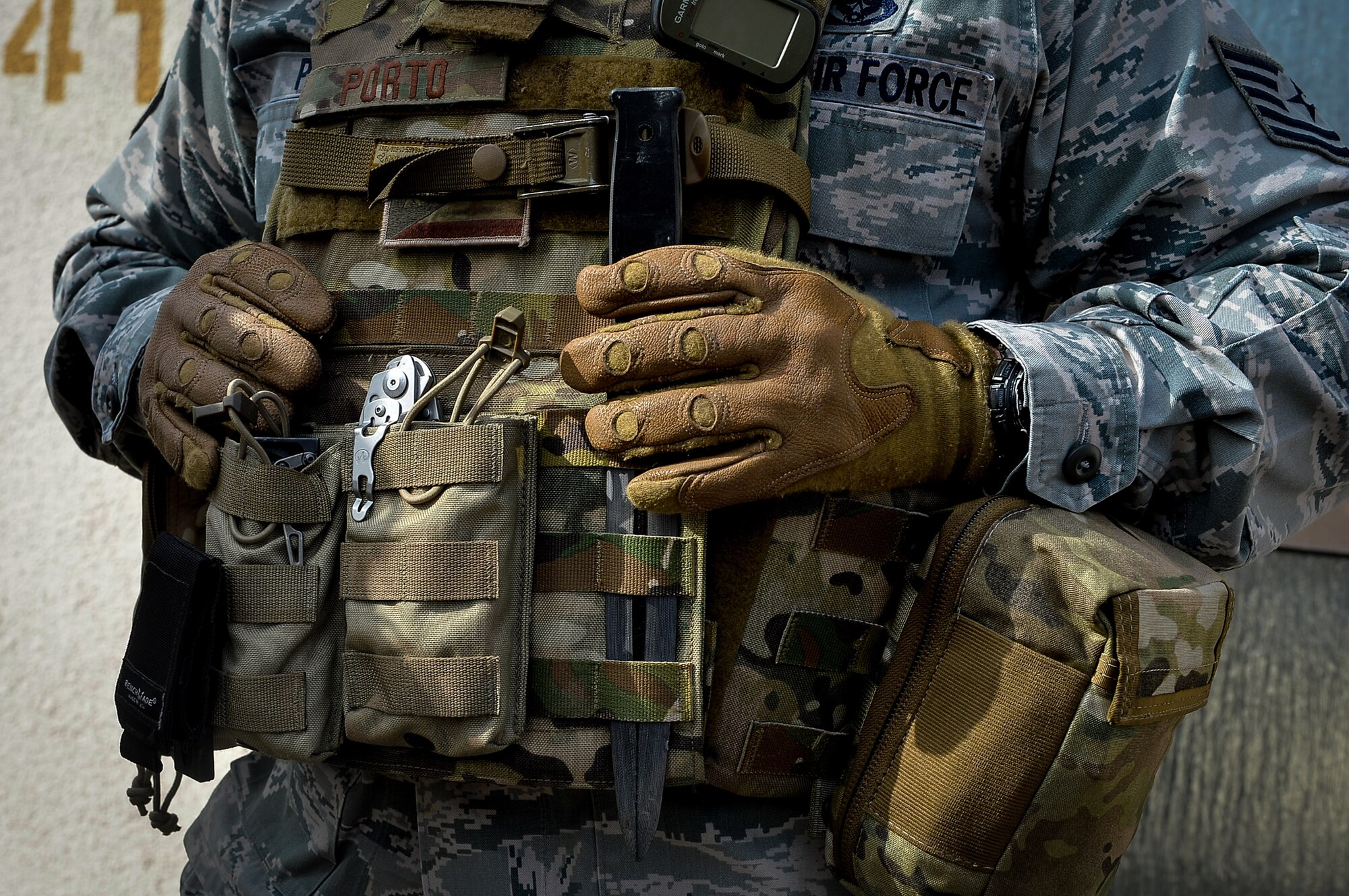 Tech. Sgt. Ricardo Porto, 786th Civil Engineer Squadron explosive ordnance disposal craftsman, rests his hands over his protective vest during an exercise on Ramstein Air Base, Germany, March 23, 2017. Exercise Silver Flag involves Airmen from a variety of career fields, and is conducted year-round by the 435th Contingency Response Group. In 2017, EOD returned for the first time in nine years to the Silver Flag curriculum on Ramstein. (U.S. Air Force photo by Airman 1st Class Joshua Magbanua)