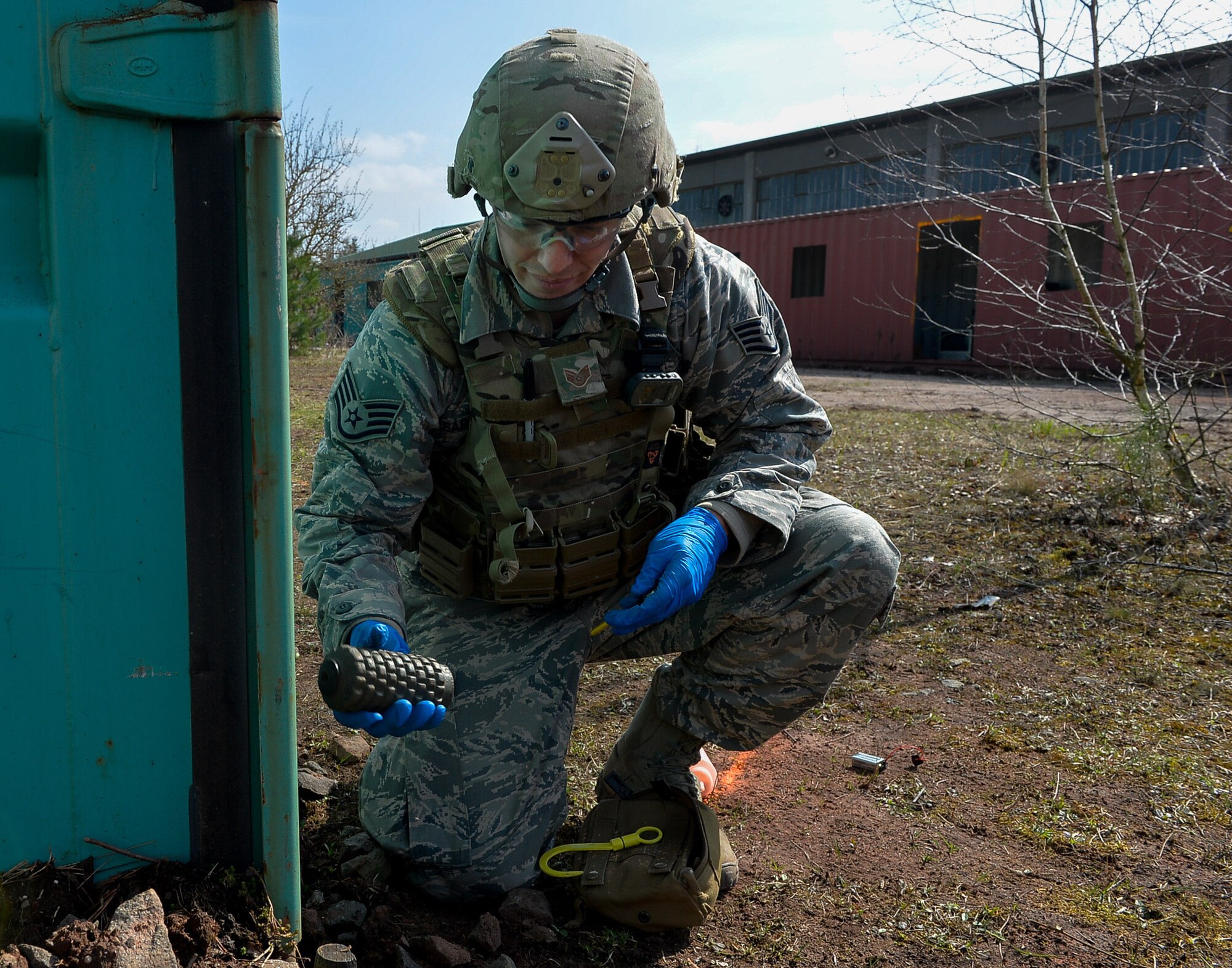 Staff. Sgt. Sam Reardon Staff Sgt. Sam Reardon, 52nd Civil Engineer Squadron explosive ordnance disposal craftsman, holds a mock explosive after neutralizing it during an exercise on Ramstein Air Base, Germany, March 23, 2017. The event took place at a newly established training ground, which featured a mock-village where various scenarios can occur. Exercise Silver Flag, which includes the EOD training, takes place more than once a year. (U.S. Air Force photo by Airman 1st Class Joshua Magbanua) 

