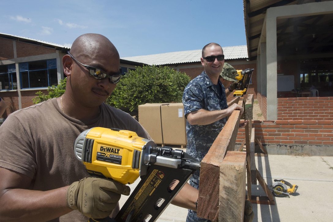 Construction Electrician 2nd Class JanRainer San Juan, a native of Fountain, Colo., assigned to Construction Battalion Maintenance, Norfolk, Va., builds a barricade for medical operations at a medical site in support of Continuing Promise 2017 (CP-17) in Mayapo, Colombia. CP-17 is a U.S. Southern Command-sponsored and U.S. Naval Forces Southern Command/U.S. 4th Fleet-conducted deployment to conduct civil-military operations including humanitarian assistance, training engagements, medical, dental, and veterinary support in an effort to show U.S. support and commitment to Central and South America. (U.S. Navy Combat Camera photo by Mass Communication Specialist 2nd Class Ridge Leoni)