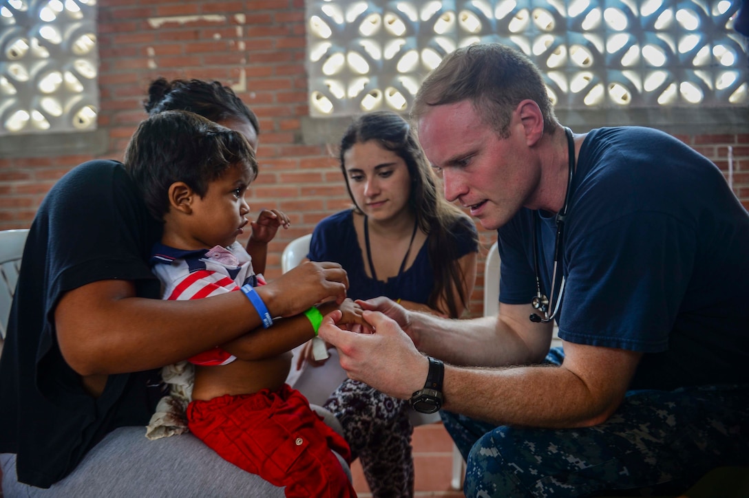 MAYAPO, Colombia (March 24, 2017) - Lt. Andrew Smith, a native of Richmond, Va., assigned to Naval Hospital Jacksonville, Fla., examines a host nation patient at the Continuing Promise 2017 (CP-17) medical site in Mayapo, Colombia. CP-17 is a U.S. Southern Command-sponsored and U.S. Naval Forces Southern Command/U.S. 4th Fleet-conducted deployment to conduct civil-military operations including humanitarian assistance, training engagements, and medical, dental, and veterinary support in an effort to show U.S. support and commitment to Central and South America. (U.S. Navy Combat Camera photo by Mass Communication Specialist 2nd Class Brittney Cannady)