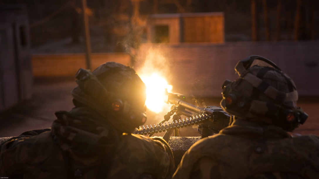 Dutch Marines provide suppressive fire with a M240B machine gun while training with U.S. Marines with 2nd Reconnaissance Battalion, 2nd Marine Division, during a Military Operation in Urban Terrain exercise at Marine Corps Base Camp Lejeune, N.C., March 23, 2017. During the integrated training exercise, Dutch and U.S. Marines worked with canine units, coordinated air assets and exchanged tactics between services in order to strengthen cohesion and interoperability between the partner two allied nations. 