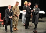 Graduates of the Milledgeville Youth Challenge Academy’s inaugural class receive congratulations March 25, 2017, from David Bill, interim campus director of the Milledgeville YCA; Maj. Gen. Joe Jarrard, the adjutant general of the Georgia National Guard and retired Maj. Gen. Peter Boylan, 20th president of Georgia Military College.

