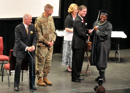 Graduates of the Milledgeville Youth Challenge Academy’s inaugural class receive congratulations March 25, 2017, from David Bill, interim campus director of the Milledgeville YCA; Maj. Gen. Joe Jarrard, the adjutant general of the Georgia National Guard and retired Maj. Gen. Peter Boylan, 20th president of Georgia Military College.

