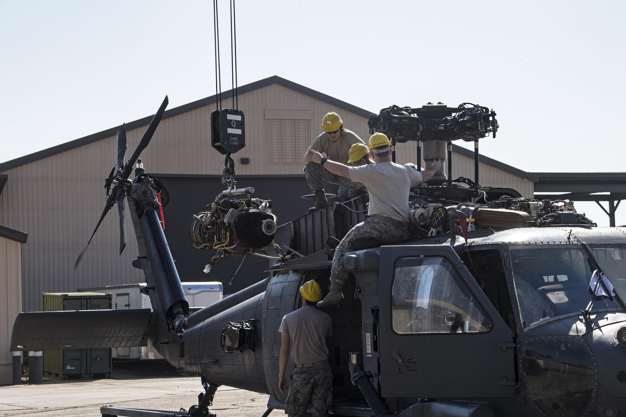 Airmen from the 41st Helicopter Maintenance Unit install an engine onto a HH-60G Pave Hawk, March 22, 2017, at Moody Air Force Base, Ga. The 41st HMU is responsible for Moody’s Pave Hawk fleet. Through innovation and preventative maintenance, they ensure each of their 13 Pave Hawks receive the upkeep needed to accomplish the mission. (U.S. Air Force photo by Airman 1st Class Janiqua P. Robinson)