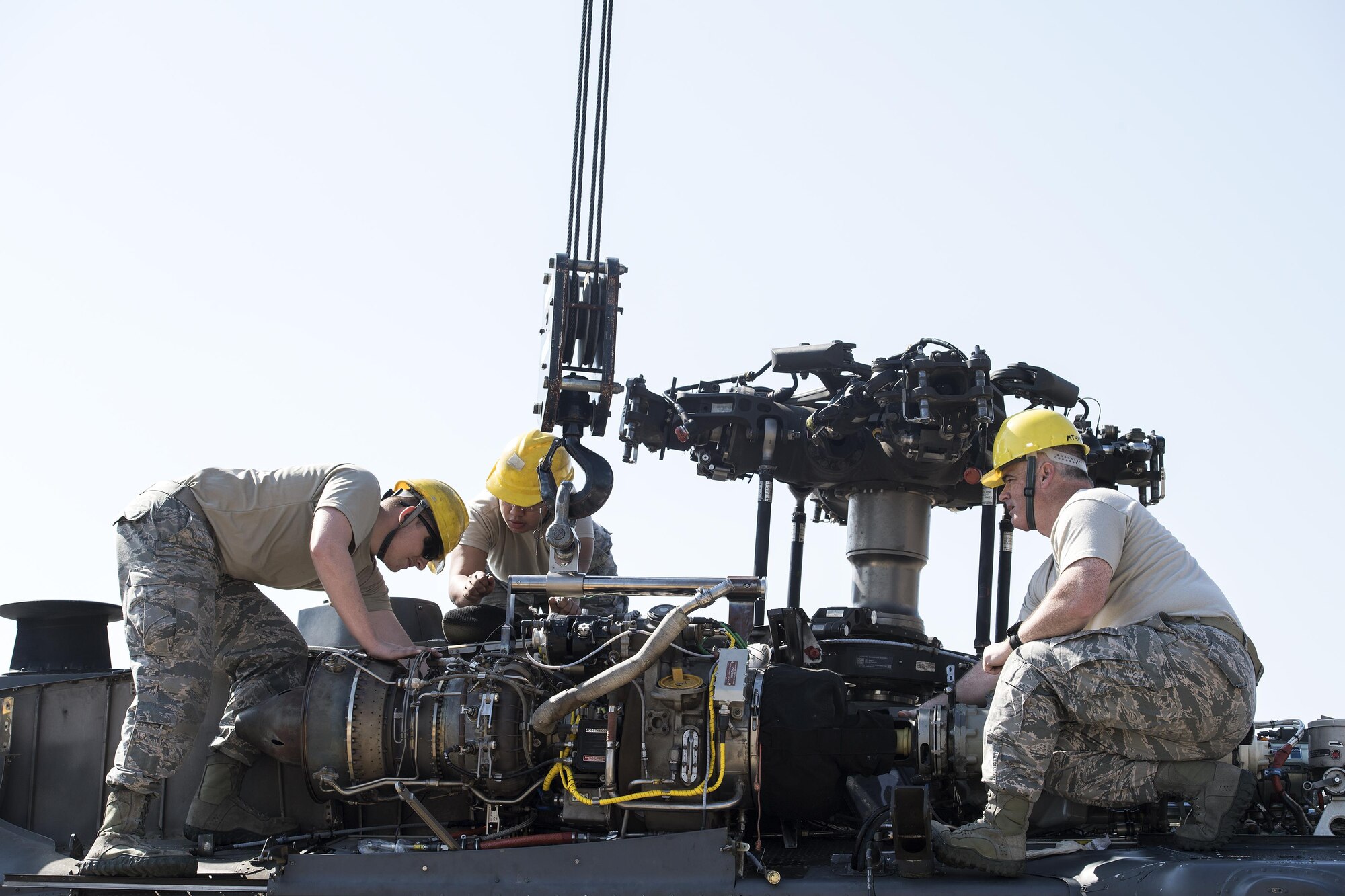 Airmen from the 41st Helicopter Maintenance Unit install an engine to a HH-60G Pave Hawk, March 22, 2017, at Moody Air Force Base, Ga. The 41st HMU is responsible for Moody’s Pave Hawk fleet. Through innovation and preventative maintenance, they ensure each of their 13 Pave Hawks receive the upkeep needed to accomplish the mission. (U.S. Air Force photo by Airman 1st Class Janiqua P. Robinson)