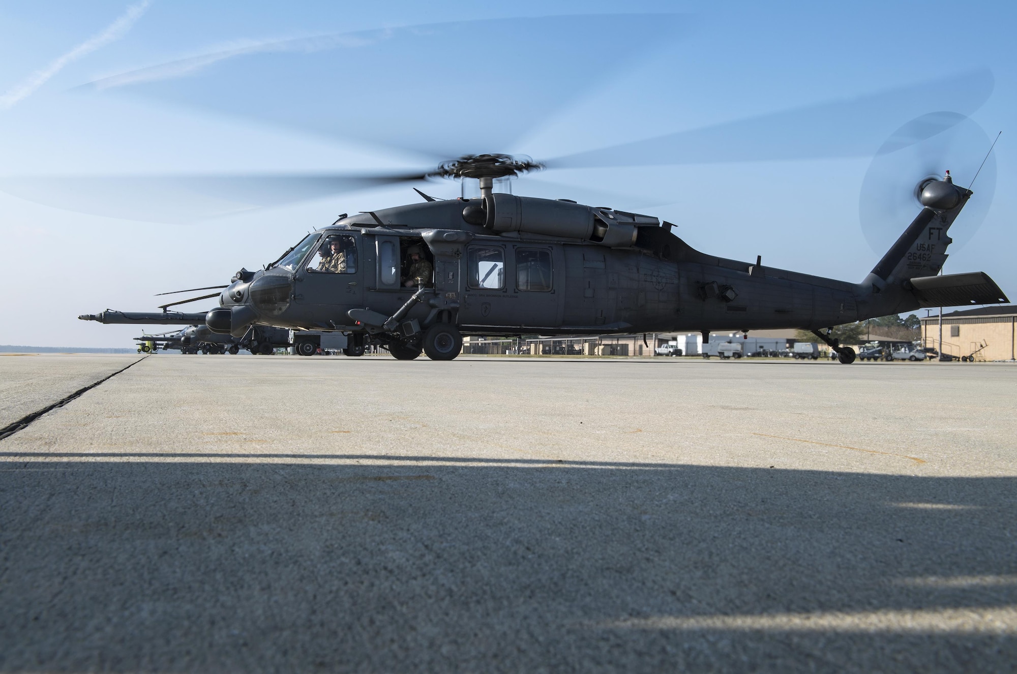An HH-60G Pave Hawk fires up near the flightline while Airmen perform a preflight systems check, March 22, 2017, at Moody Air Force Base, Ga. The 41st HMU is responsible for Moody’s Pave Hawk fleet. Through innovation and preventative maintenance, they ensure each of their 13 Pave Hawks receive the upkeep needed to accomplish the mission. (U.S. Air Force photo by Airman 1st Class Janiqua P. Robinson)