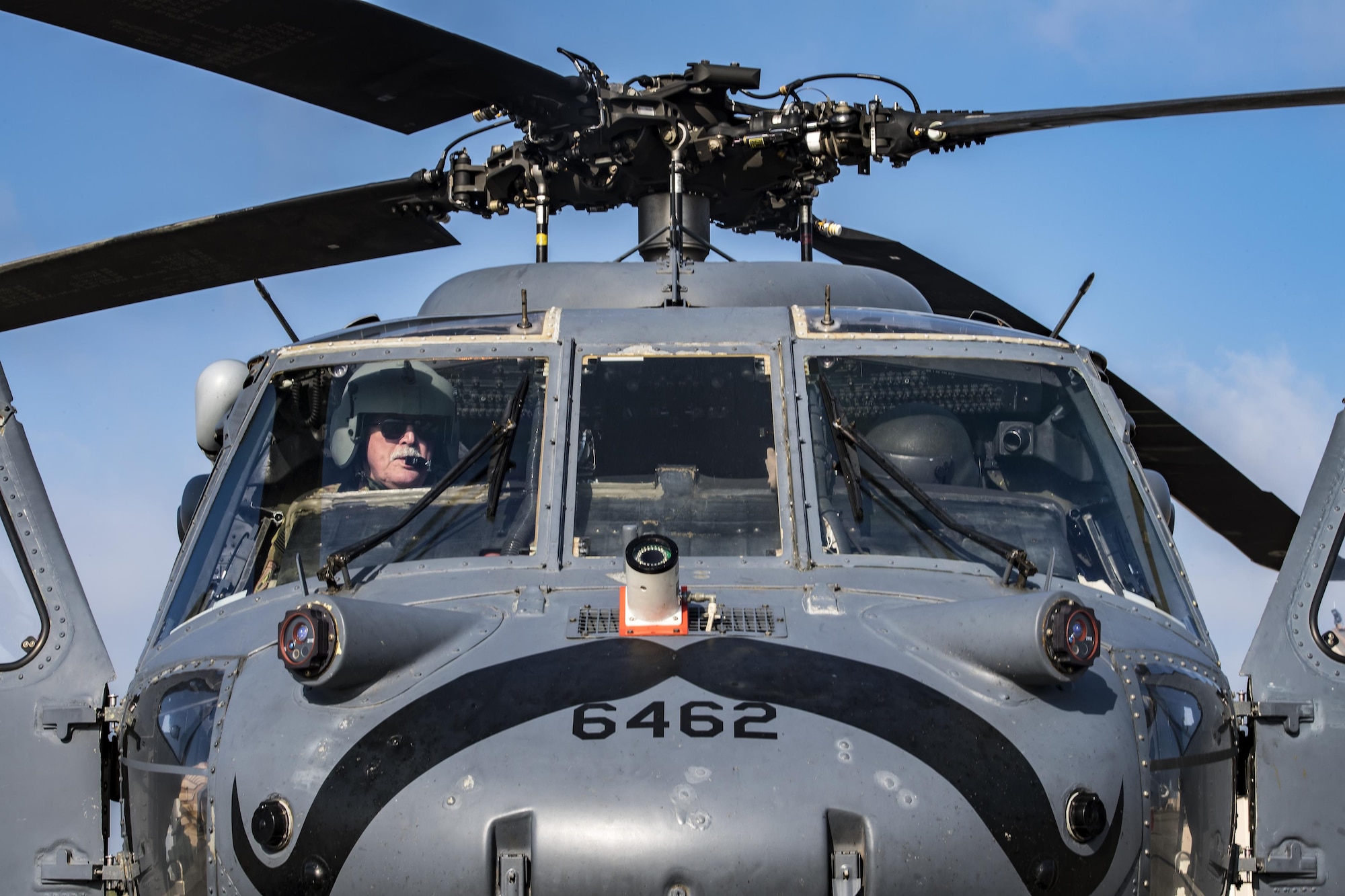 Retired U.S. Army Chief Warrant Officer 3, James Turnage Sr., 41st Helicopter Maintenance Unit contractor maintenance pilot, left, performs a preflight systems check, March 22, 2017, at Moody Air Force Base, Ga. The 41st HMU is responsible for Moody’s Pave Hawk fleet. Through innovation and preventative maintenance, they ensure each of their 13 Pave Hawks receive the upkeep needed to accomplish the mission. (U.S. Air Force photo by Airman 1st Class Janiqua P. Robinson)
