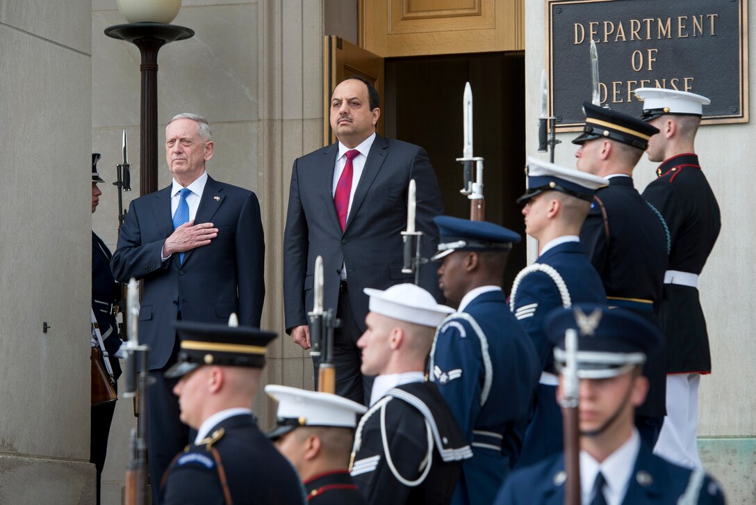 Defense Secretary Jim Mattis, left, and Qatari Defense Minister Khalid bin Mohammed al-Attiyah render honors during the playing of U.S. and Qatari national anthems at the Pentagon, March 27, 2017. DoD photo by Air Force Tech. Sgt. Brigitte N. Brantley