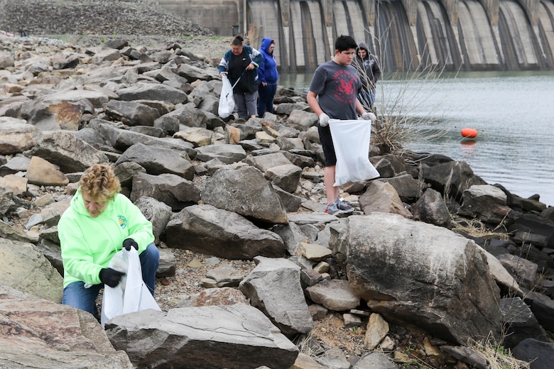 Volunteers pick up trash at Lake Eufaula as part of the bi-annual cleanup effort by the local organization Team Up to Clean Up.
