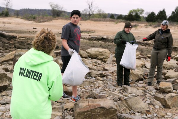 Volunteers pick up trash at Lake Eufaula as part of the bi-annual cleanup effort by the local organization Team Up to Clean Up.