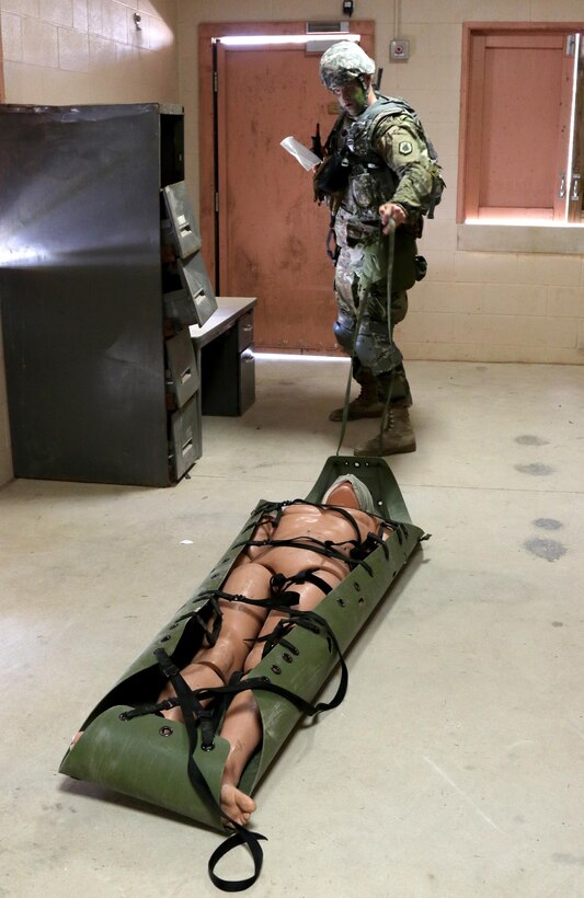 Army Reserve Spc. Keith Rhodes, a Greenville, N.Y. native and Soldier with 3rd Brigade, 98th Training Division (Initial Entry Training), performs tactical first aid during the Warrior Training Tasks portion of the 108th Training Command (IET) Best Warrior Competition at Camp Bullis, Texas, March 19-24, 2017.  Rhodes won the Soldier of the Year title for the 98th Training Division (IET). (U.S. Army Reserve Photo by Maj. Michelle Lunato/released)