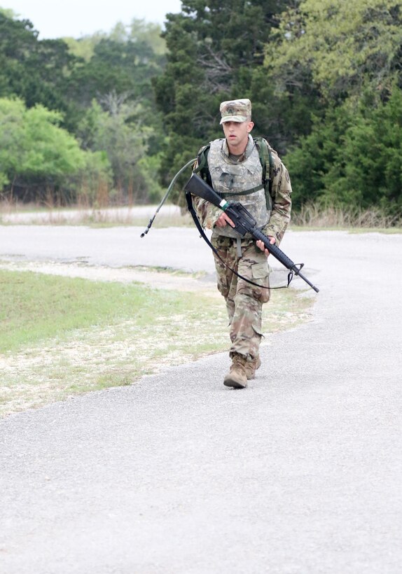 Army Reserve Sgt. Christopher Moses, a Eugene, Oreg. native and drill sergeant with Charlie Company, 3-378th, 95th Training Division (Initial EntryTraining), reaches the mid-point of a 10k road march during the 108th Training Command (IET) 2017 Drill Sergeant of the Year Competition at Camp Bullis, Texas, March 19-24, 2017. Moses won the Drill Sergeant of the Year title for the 108th TC (IET) at the end of the grueling six-day competition and will represent the U.S. Army Reserve at the Training and Doctrine Command Drill Sergeant of the Year competition later this year. Moses said being a Citizen-Soldier allows him to serve his country while maintaining a civilian job. "As a Citizen-Soldier, my primary job is neither as a civilian or Soldier, but being ready and capable in each capacity." (U.S. Army Reserve photo by Maj. Michelle Lunato/released)