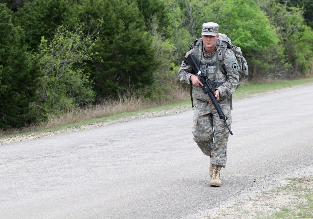 Army Reserve Staff Sgt. Miguel Gallegos, an Omaha, Nebraska native and drill sergeant with Foxtrot Company, 3-485th Battalion, 1st Brigade, 98th Training Division (Initial Entry Training), nears the finish line of his 10k road march during the 108th Training Command (IET) 2017 Best Warrior Competition at Camp Bullis, Texas, March 19-24. Gallegos won the Noncommissioned Officer of the Year title for the 98th Training Division (IET). (U.S. Army Reserve photo by Maj. Michelle Lunato.)