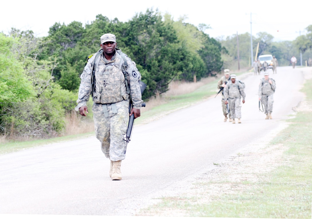 Army Reserve Staff Sgt. Vanqualis Battles, 1st  Brigade, 98th Training Division (Initial Entry Training), nears the finish of his 10k road march on March 21 during the 108th Training Command (IET) 2017 Best Warrior Competition at Camp Bullis, Texas. (U.S. Army Reserve photo by Maj. Michelle Lunato/released)