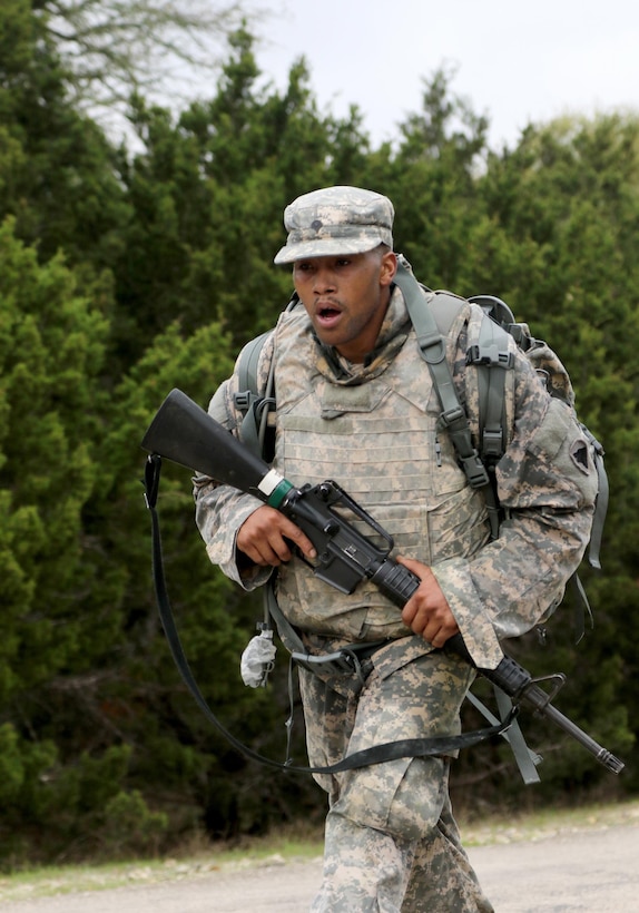 Army Reserve Spc. Michael Parrish Jr., a Petersburg, Virg. native and human resources specialist with Alpha Company, 2-319th, 104th Training Division (LT), finishes his 10k road march during the 108th Training Command (IET) Best Warrior Competition at Camp Bullis, Texas, March 19-24, 2017. Parrish earned the title of 2017 Soldier of the Year for the 104th Training Division (LT).  (U.S. Army Reserve photo by Maj. Michelle Lunato.)