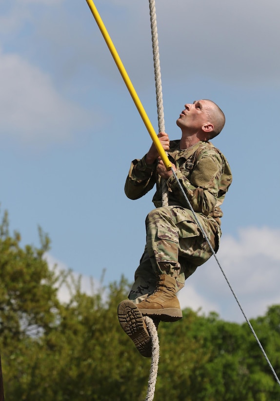 Army Reserve Staff Sgt. Eric Juhl, a Phoenix, Ariz. native and drill sergeant with Bravo Company, 3-415th Infantry Regiment, 2nd Brigade, 95th Training Division (Initial Entry Training) completes an oabstcle during the 108th Training Command (IET) Drill Sergeant of the Year Competition at Camp Bullis, Texas, March 19-24, 2017.  (U.S. Army Reserve photo by Maj. Michelle Lunato.)