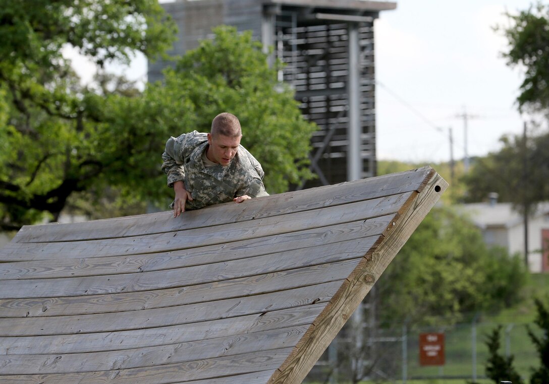 Army Reserve Staff Sgt. Nicholas Minior, a drill sergeant with 3rd Brigade, 98th Training Division (Initial Entry Training), navigates an obstacle during the 108th Training Command (IET) 2017 Drill Sergeant of the Year Competition at Camp Bullis, Texas, March 19-24.  (U.S. Army Reserve Photo by Maj. Michelle Lunato/released)