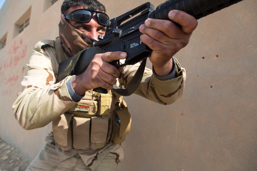 An Iraqi security forces soldier provides security during urban assault training at Camp Manion, Iraq, March 21, 2017. Coalition forces train ISF basic combat skills to increase success on the battlefield in support of Combined Joint Task Force – Operation Inherent Resolve, the global Coalition to defeat ISIS in Iraq and Syria.  (U.S. Army photo by Spc. Christopher Brecht)