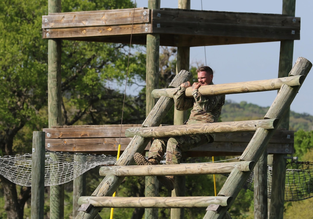 Army Reserve Staff Sgt. Nicholas Smolen, a Manitowoc, Wis. native and a radiology specialist with Bravo Company, 1st Battalion, 334th Infantry Regiment (Training Support Battalion), 95th Training Division (Initial Entry Training), navigates an obstacle during the 108th Training Command (IET) Best Warrior Competition at Camp Bullis, Texas, March 19-24, 2017. Smolen was inspired to serve in the military by his grandfater who served in WWII and was awarded the Purple Heart. (U.S. Army Reserve photo by Maj. Michelle Lunato/released.)
