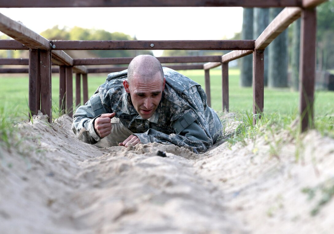 Army Reserve Spc. Enrique Gonzalez, an Elkton, Maryland native and infrantryman with Echo Company, 1-304th Infantry Regiment, 4th Brigade, 98th Training Division (Initial Entry Training) completes the final obstacle during the 108th Training Command (IET) Best Warrior Competition at Camp Bullis, Texas, March 19-24, 2017.  (U.S. Army Reserve photo by Maj. Michelle Lunato.)