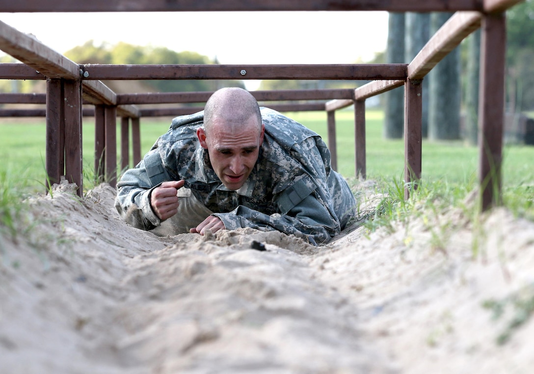 Army Reserve Spc. Enrique Gonzalez, an Elkton, Maryland native and infrantryman with Echo Company, 1-304th Infantry Regiment, 4th Brigade, 98th Training Division (Initial Entry Training) completes the final obstacle during the 108th Training Command (IET) Best Warrior Competition at Camp Bullis, Texas, March 19-24, 2017.  (U.S. Army Reserve photo by Maj. Michelle Lunato.)