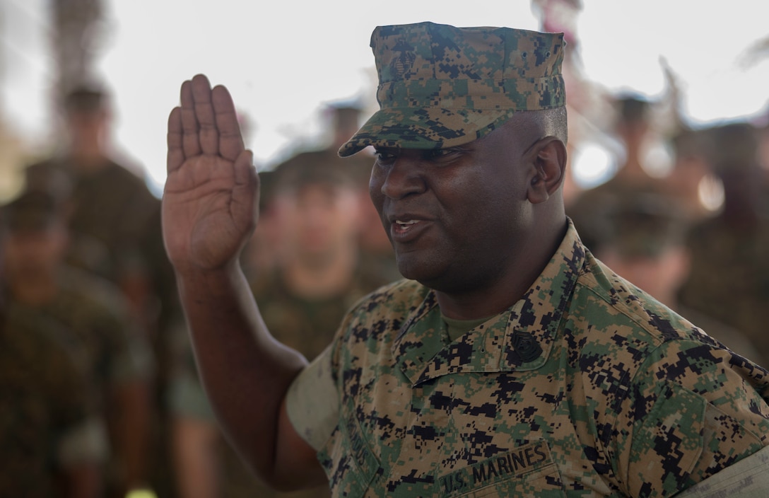 Sgt. Maj. Alfred R. Broadus, Recruiting Station sergeant major, RS Orlando, Fla., takes the oath of enlistment for the final time at Marine Corps Base Camp Pendleton, Calif., March 22, 2017.  Twenty two years ago, Col. Roberta Shea, commanding officer of I Marine Expeditionary Force Headquarters Group, had the honor of being his first reenlistment officer and now his last. (U.S. Marine Corps photo by Lance Cpl. A. J. Van Fredenberg)
