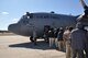 Senior Master Sgt. Tom Marhulik, from the 757th Airlift Squadron, directs Air Force Junior Reserve Officer Training Corps (JROTC) Cadets onto a C-130H Hercules for an orientation flight March 22, 2017. The cadets are with AFJROTC PA-931 at Cathedral Preparatory School, Erie, Pennsylvania. The purpose of the event was to show the cadets some opportunities in the Air Force Reserve. (U.S. Air Force photo/Maj. Polly Orcutt)