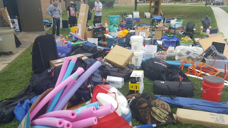 A group of Laughlin Airmen clean Laughlin’s Youth Center’s storage during a cleanup event on March 18, 2017. A group of volunteers helped clean the base while helping foster new frendships. (Courtesy Photo)