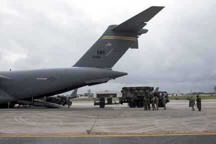 Japan Ground Self-Defense Force members observe Soldiers of the 1st Battalion, 1st Air Defense Artillery Regiment load Patriot missile battery equipment onto a C-17 Globe Master III March 14, 2017, on Kadena Air Base, Japan. The Patriot missile system is a long-range air defense asset and can be broken down to be transported via plane anywhere in the world in a matter of hours.