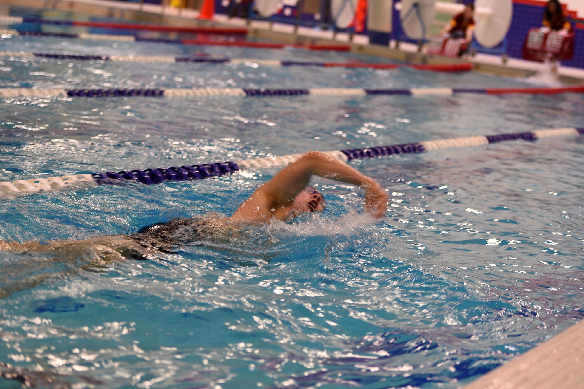 A Junior ROTC Indoor Triathlon swimmer from Chugiak High School swims during the JROTC Indoor Triathlon at Buckner Physical Fitness Center at Joint Base Elmendorf-Richardson, Alaska, March 25, 2017. Nine teams of eight athletes competed in a timed swim, bike and run. The annual event has been hosted at Buckner PFC since January 2005.