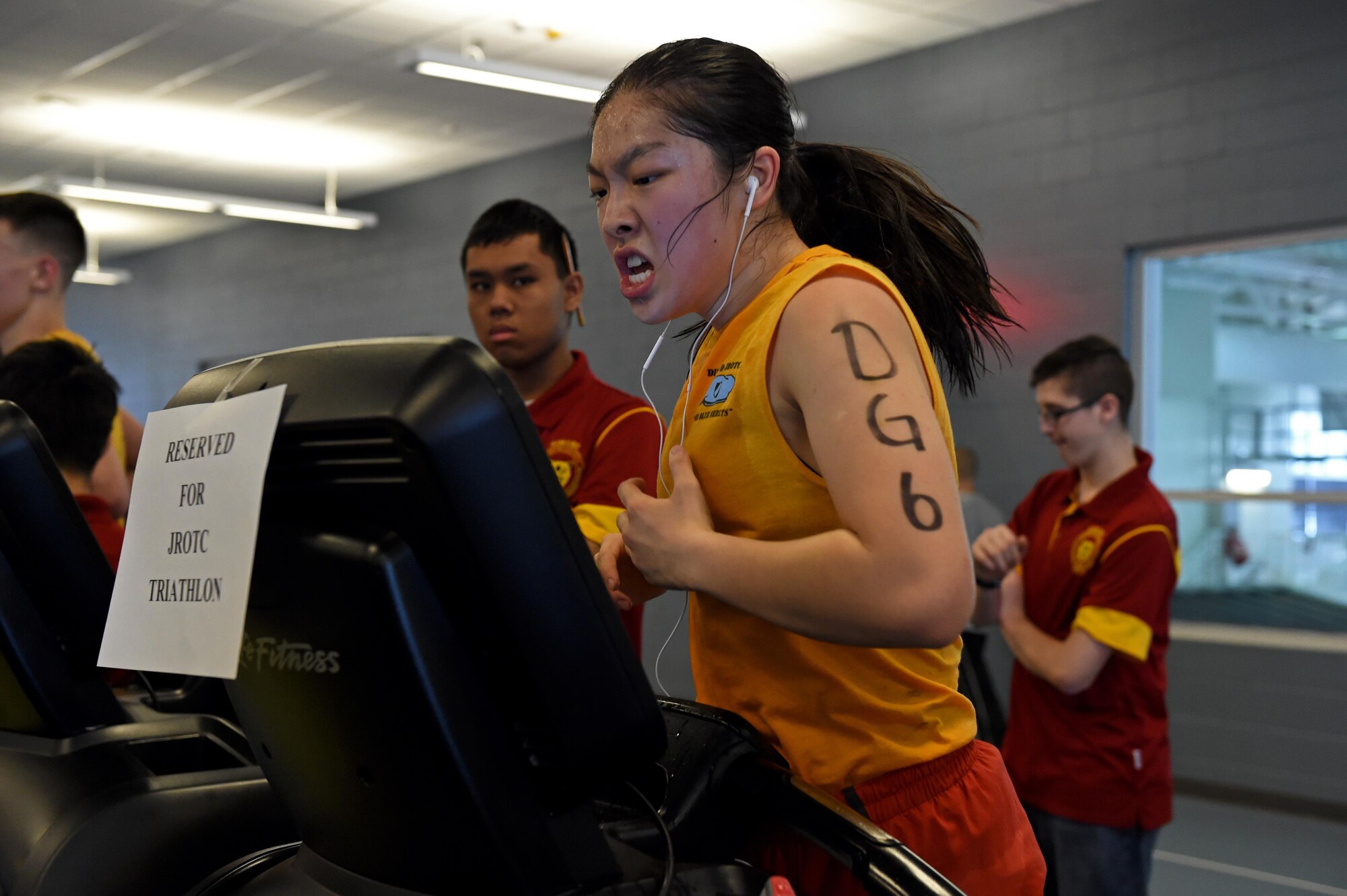 Miao Miao Yuan, a Dimond High School Junior ROTC cadet, sprints during the JROTC Indoor Triathlon at Buckner Physical Fitness Center at Joint Base Elmendorf-Richardson, Alaska, March 25, 2017. Nine teams of eight athletes competed in a timed swim, bike and run. The annual event has been hosted at Buckner PFC since January 2005.